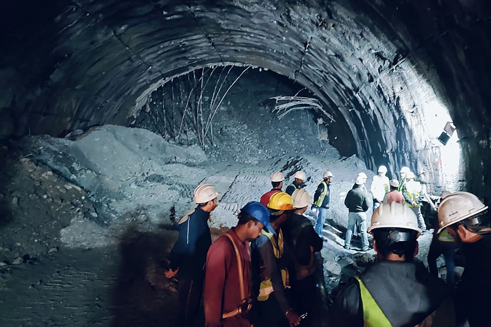 In this photograph taken on November 12, 2023, rescue workers gather at the site after a tunnel collapsed in the Uttarkashi district of India's Uttarakhand state. Photo by AFP