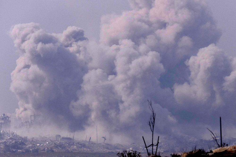 Smoke billowing during Israeli bombardment on the Palestinian enclave on November 18, 2023. (Photo by Kenzo Tribouillard / AFP)
