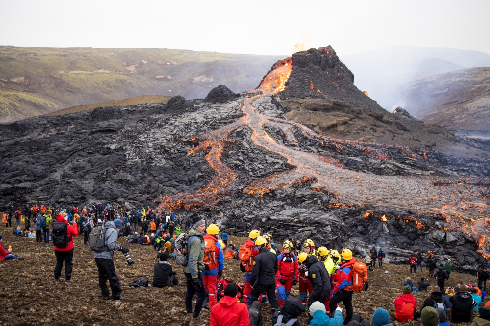 File photo for representational purposes only. People gather at the volcanic site on the Reykjanes Peninsula following Friday's eruption in Iceland, March 21, 2021. REUTERS/Cat Gundry-Beck

