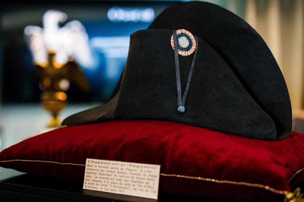 (FILES) A black bicorne hat with red, white and blue cockade worn by the French Emperor Napoleon I (1769-1821), from the Collection of Jean Louis Noisiez, is displayed before an auction sale at Osenat auction house in Paris on November 6, 2023. (Photo by Dimitar DILKOFF / AFP)
