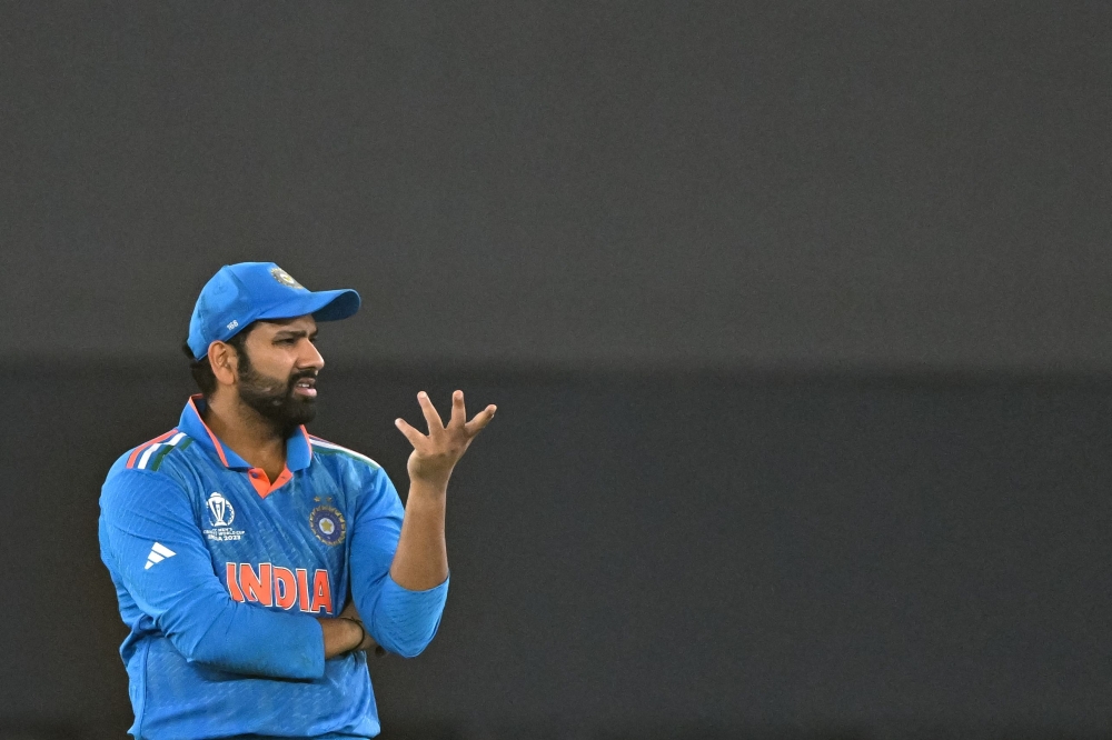 India's captain Rohit Sharma gestures during the 2023 ICC Men's Cricket World Cup one-day international (ODI) final match between India and Australia at the Narendra Modi Stadium in Ahmedabad on November 19, 2023. (Photo by Sajjad HUSSAIN / AFP)