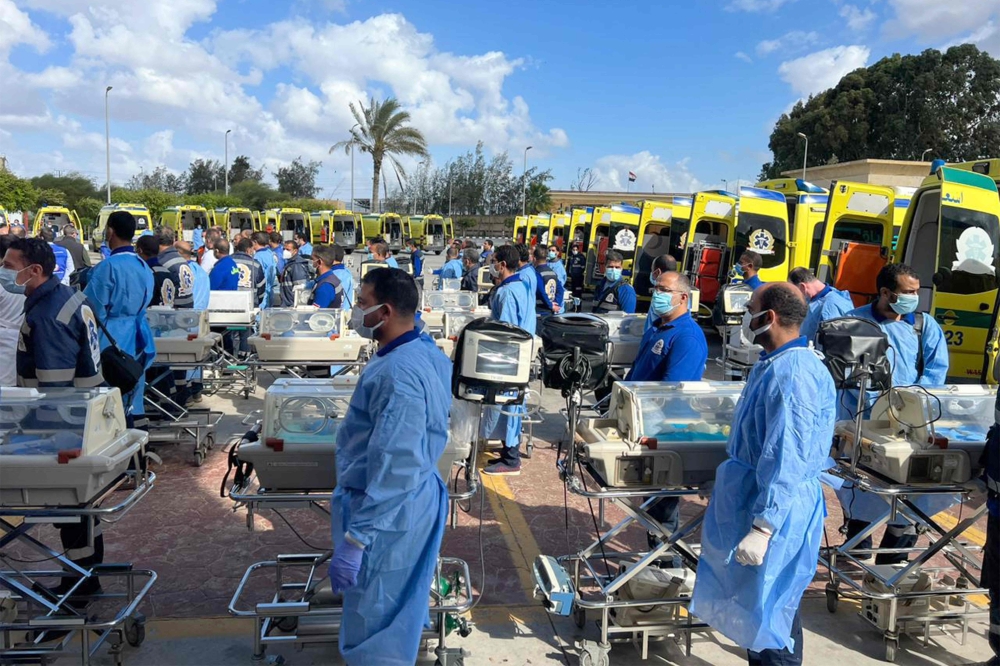 Egyptian medics stand by with incubators to receive premature Palestinian babies evacuated from Gaza on the Egyptian side of the Rafah border crossing with the Gaza Strip, on November 20, 2023. (Photo by AFP)