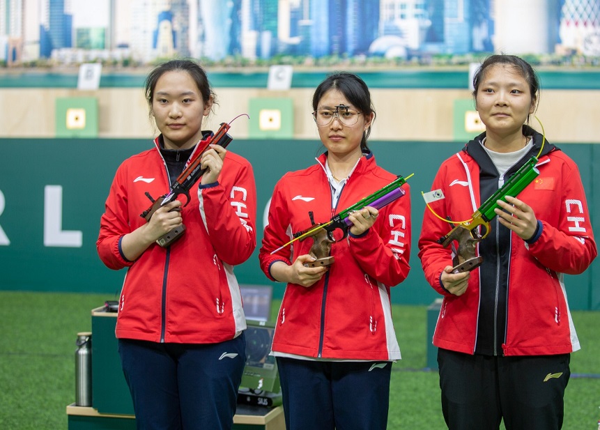 Women's 10m Air Pistol champion China's Xue Li (centre), silver winner Nan Zhao and third placed Ranxin Jiang. 