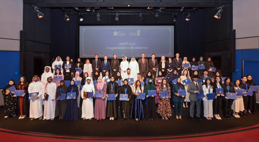 UDST President Dr. Salem Al Naemi and other officials with high-achieving students at the awards.