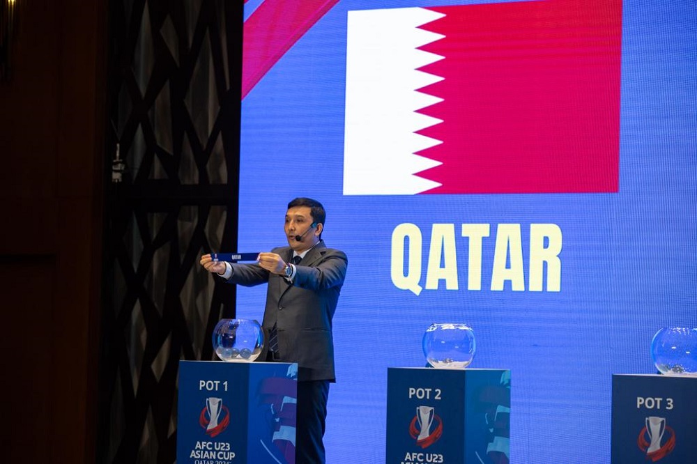 An official draws Qatar during the draw ceremony in Doha yesterday. 