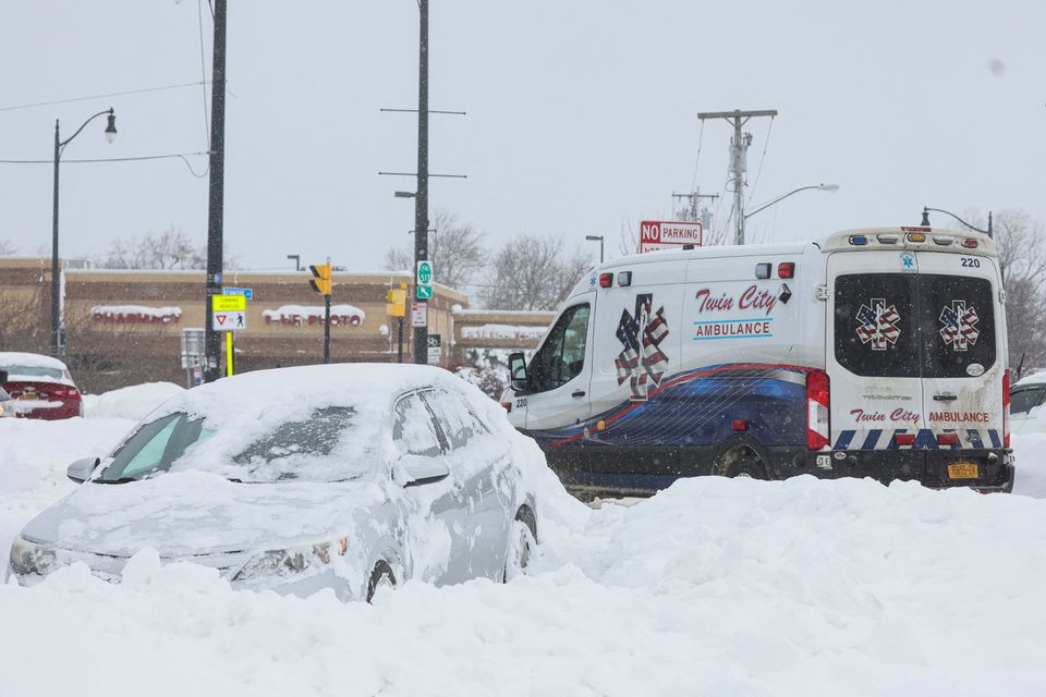 File photo: An ambulance passes an abandon car during a winter storm that hit the Buffalo region, in Amherst, New York, US, on December 26, 2022. (Reuters)