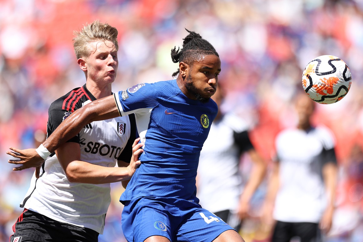 (FILES) Christopher Nkunku of Chelsea is challenged by Luc De Fougerolles of Fulham during the Premier League Summer Series match between Chelsea FC and Fulham FC at FedExField on July 30, 2023 in Landover, Maryland. Tim Nwachukwu/Getty Images/AFP


