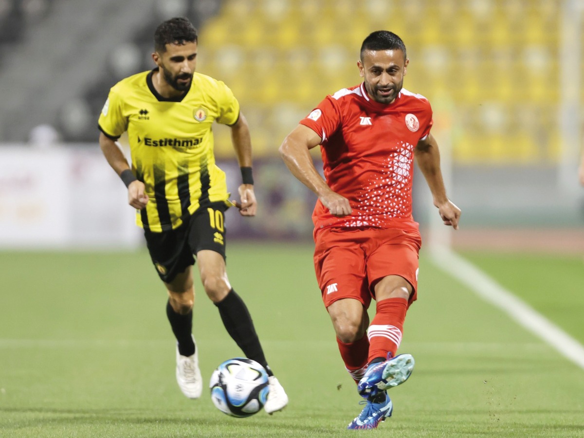 Al Shamal's Omid Ebrahimi (right) shoots at the goal.