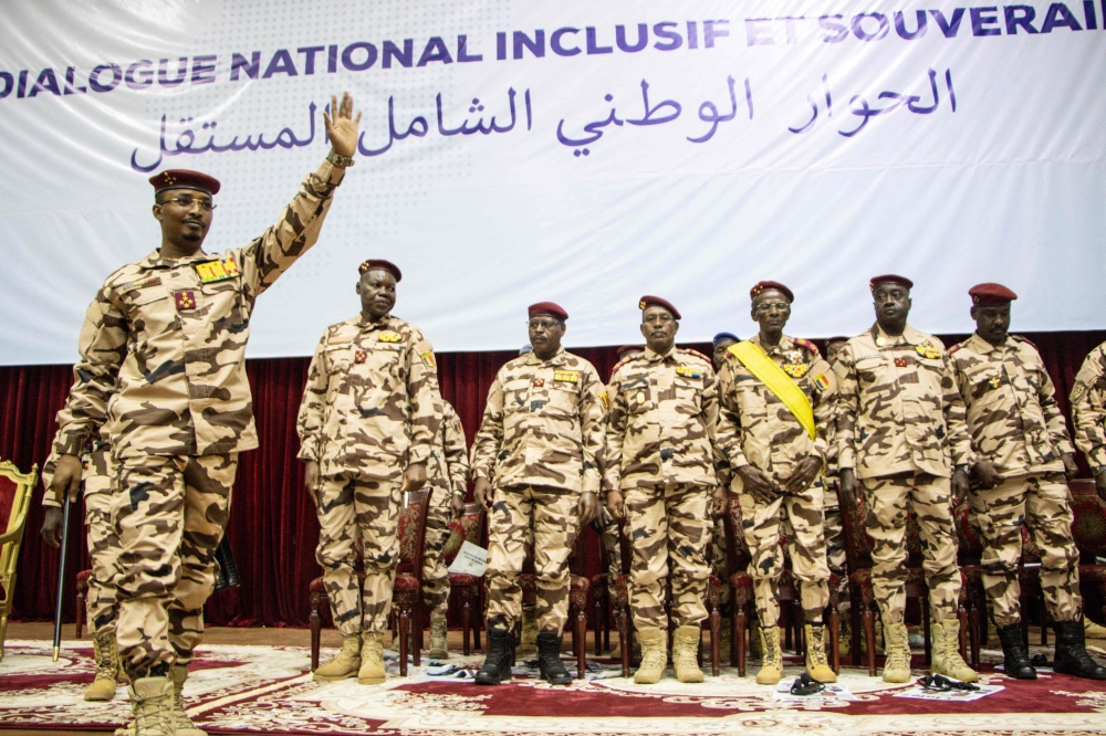 (FILES) Transition President Mahamat Idriss Deby Itno (L) gestures during the opening ceremony of the national dialogue at the January 15 Palace in N'Djamena, on August 20, 2022. (Photo by AURELIE BAZZARA-KIBANGULA / AFP)
