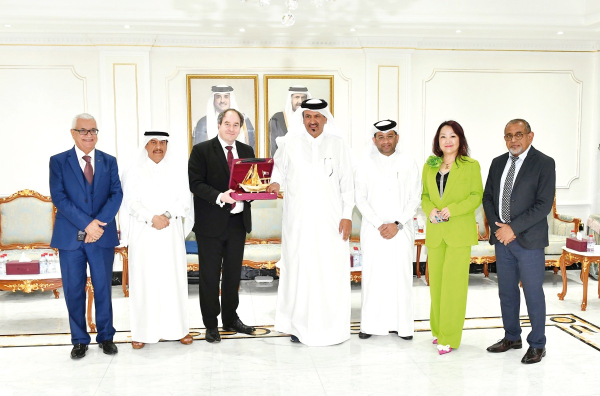 Officials pose for a group photo during the meeting.