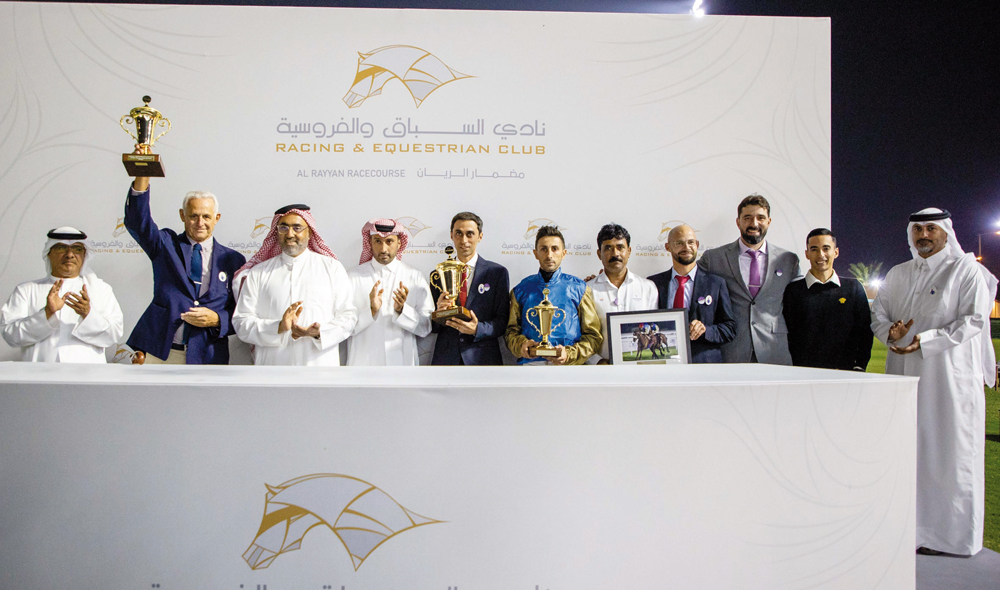 The connections of Kovanof celebrate with their trophies after the Thoroughbred Derby Trial win at Al Rayyan Racecourse yesterday. PICTURES: Juhaim/QREC  