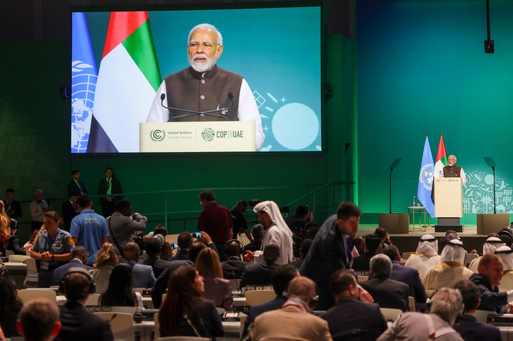 India Prime Minister Narendra Modi speaks at the High-Level Segment for Heads of State and Government session during the United Nations climate summit in Dubai on December 1, 2023. (Photo by Giuseppe Cacace / AFP)