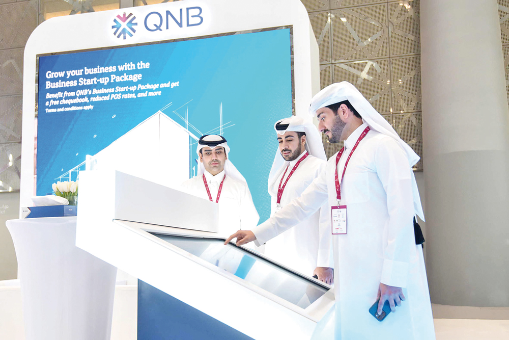 Officials at QNB booth during the ninth edition of the Made in Qatar exhibition.