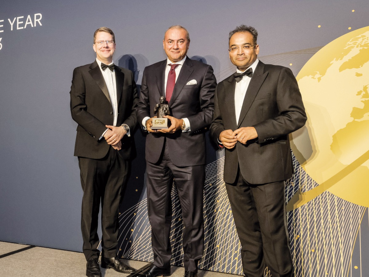 QIB Group CEO Bassel Gamal receiving the award by The Banker Magazine.