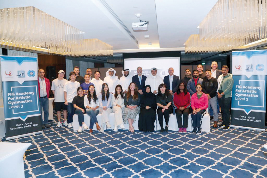 Qatar Gymnastics Federation President Ali Ahmed Al Hitmi and Secretary General, Ms Abeer Al Buanain along with officials and participants pose for a photograph at the inauguration of the FIG Academy for Artistic Gymnastics Level III coaching course in Doha.