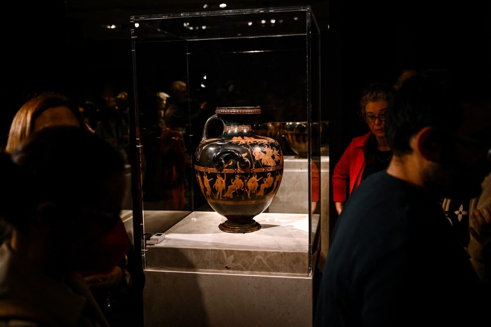 This photograph taken on December 5, 2023 shows 'Meidias hydria', a 2,500-year-old Greek vase on loan from the British museum, displayed in the the temporary exhibition titled 