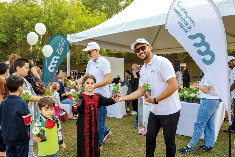 Al Abdulghani Motors officials taking part in 'Children Above All' event at the Education City.