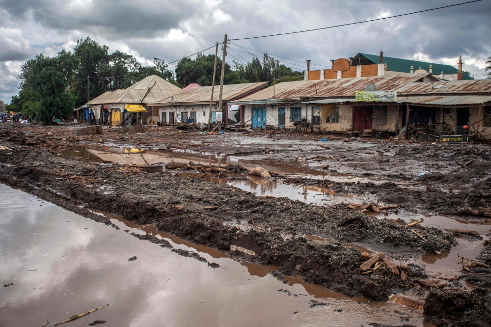 Streets are seen covered on mud following landslides and flooding triggered by heavy rainfall in Katesh, Tanzania on December 5, 2023. (Photo by Ebby SHABAN / AFP)
