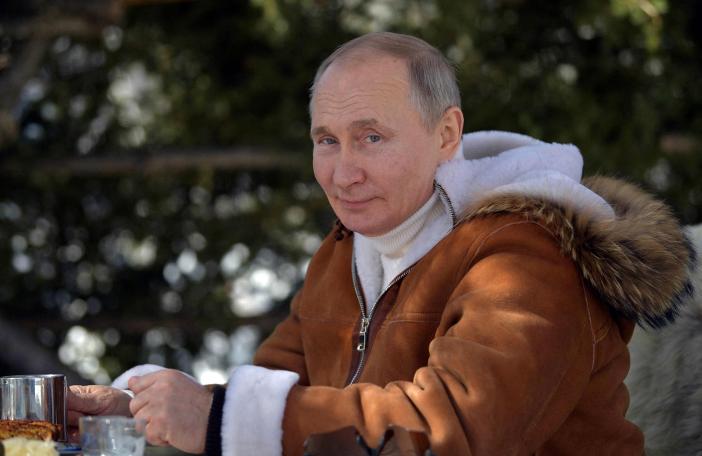 File: Russian President Vladimir Putin poses for a photograph as he rests during his holiday in Siberian federal district on March 21, 2021. (Photo by Alexey Druzhinin / Sputnik / AFP)
