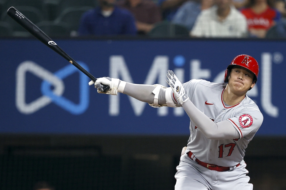 Shohei Ohtani #17 of the Los Angeles Angels bats against Dane Dunning #33 of the Texas Rangers in the top of the first inning at Globe Life Field on April 28, 2021 in Arlington, Texas. Photo by TOM PENNINGTON / GETTY IMAGES NORTH AMERICA / AFP