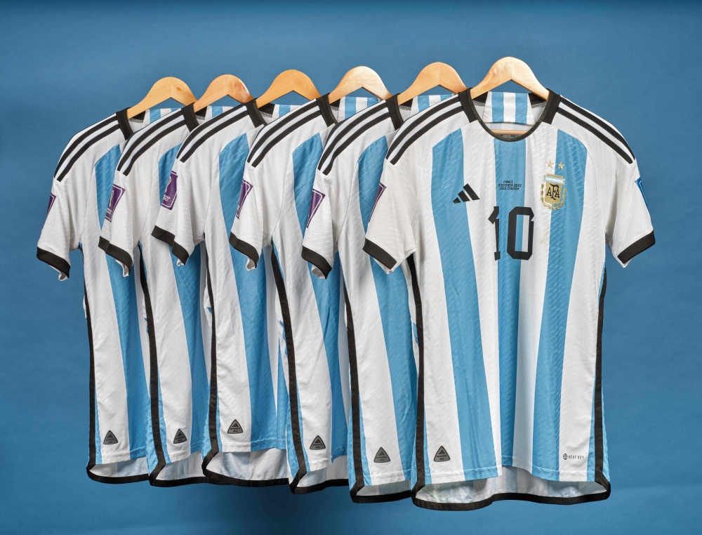 This undated photo courtesy of Sotheby's shows Lionel Messi's set of six match worn shirts from the 2022 FIFA World Cup. (Photo by SOTHEBY'S / AFP) 

