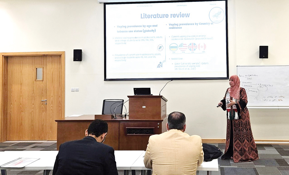 Students and faculty at QU’s College of Health Sciences discuss graduation projects.
