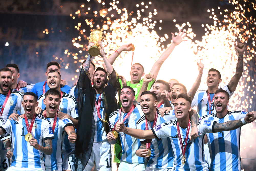 Argentina's Lionel Messi lifts the World Cup trophy during the Qatar 2022 World Cup trophy ceremony at Lusail International Stadium, in this December 18, 2022 file photo. AFP