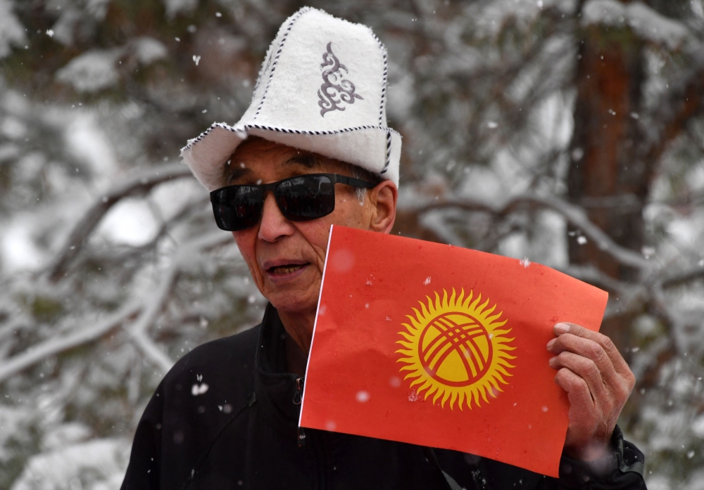 (Files) Demonstrators protest against the changing of the Kyrgyz national flag in Bishkek on December 9, 2023. (Photo by Vyacheslav Oseledko / AFP)