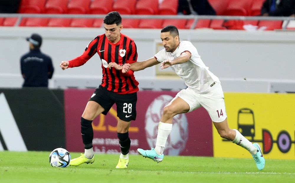 Al Rayyan’s Achraf Bencharki (left) in action against Al Markhiya’s Tameem Mohammed yesterday.