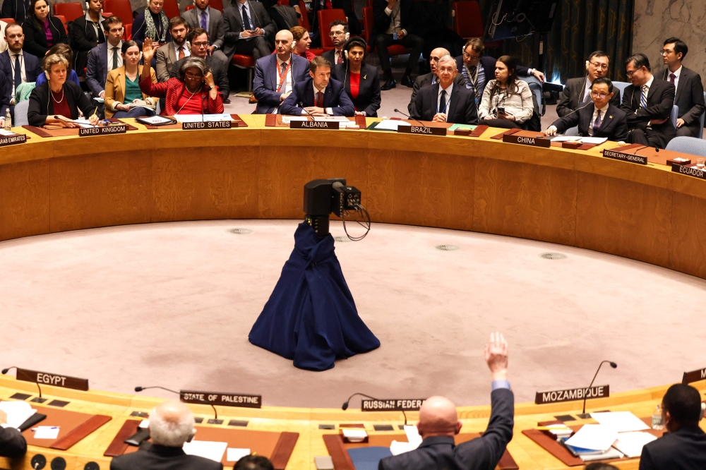 Ambassadors vote during a meeting about the situation in the Middle East, including the Palestinian question, at UN headquarters in New York on December 22, 2023.(Photo by Charly Triballeau / AFP)