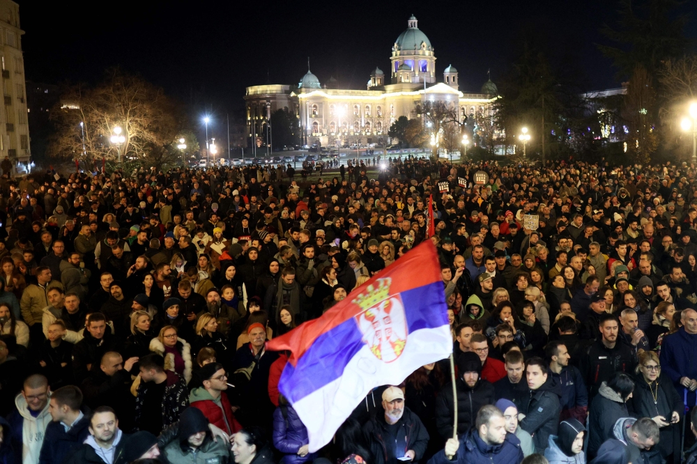 Protesters gather in front of Belgrade's city council building during a demonstration in Belgrade, on December 24, 2023. (Photo by OLIVER BUNIC / AFP)
