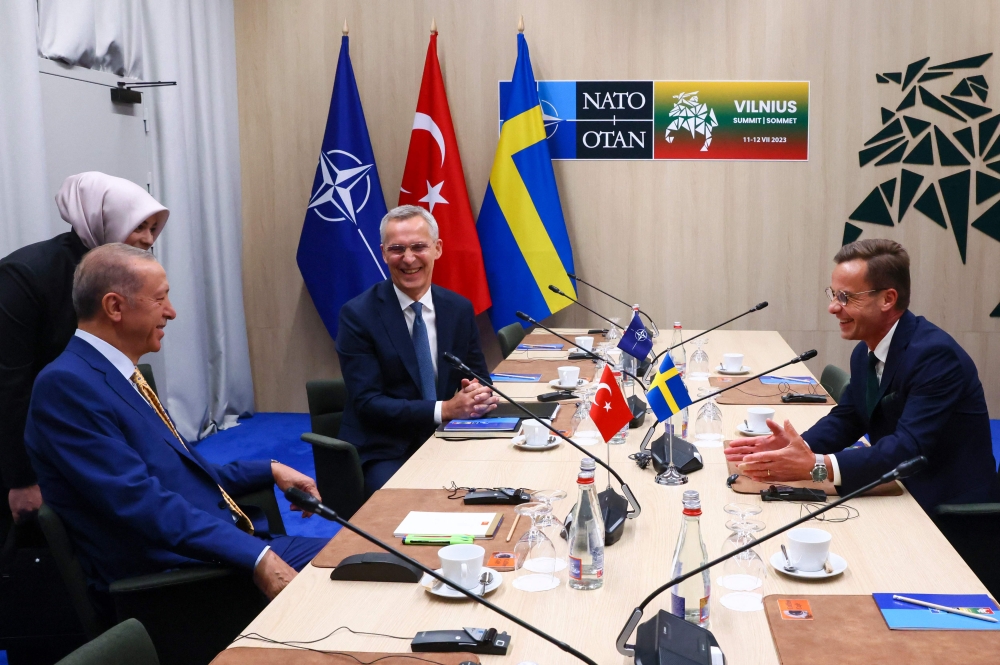 File photo: NATO Secretary-General Jens Stoltenberg (top center), Turkish President Tayyip Erdogan and Swedish Prime Minister Ulf Kristersson (right) during a meeting, on the eve of a NATO summit, in Vilnius on July 10, 2023. (Photo by Yves Herman / AFP)

