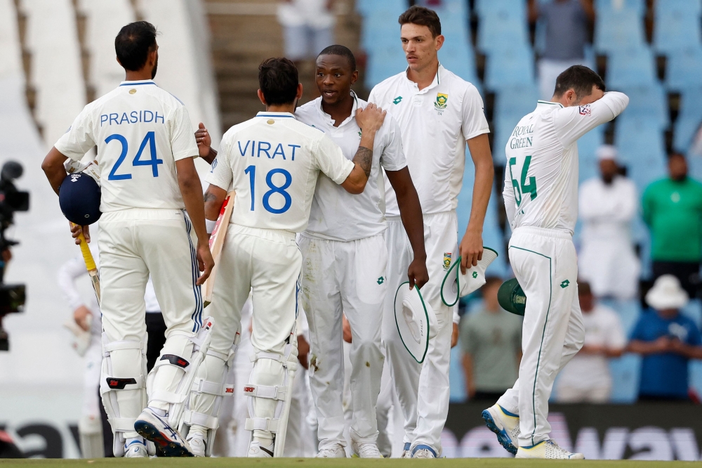 South Africa's Kagiso Rabada greets India's Virat Kohli after South Africa won the first cricket test match between South Africa and India at SuperSport Park in Centurion on December 28, 2023. (Photo by Phill Magakoe / AFP)