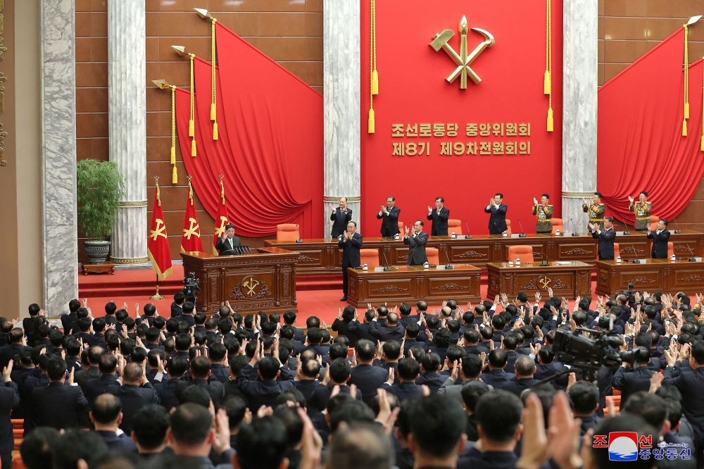 This picture taken on December 27, 2023 and released from North Korea's official Korean Central News Agency on December 28, 2023 shows North Korean leader Kim Jong Un (left) attending the second day of the 9th plenary meeting of the 8th Central Committee of the Workers' Party of Korea (WPK) at the office building of the WPK Central Committee in Pyongyang. (Photo by KCNA VIA KNS / AFP) 

