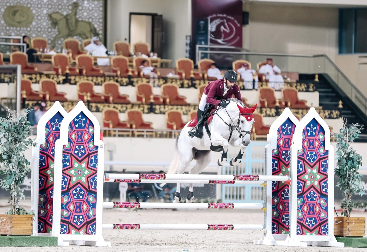 Mohammed Dhafi Al Marri guides Destiny 297 over a fence during the Small Tour event.