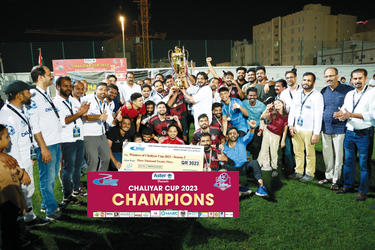 The winning team with the trophy.