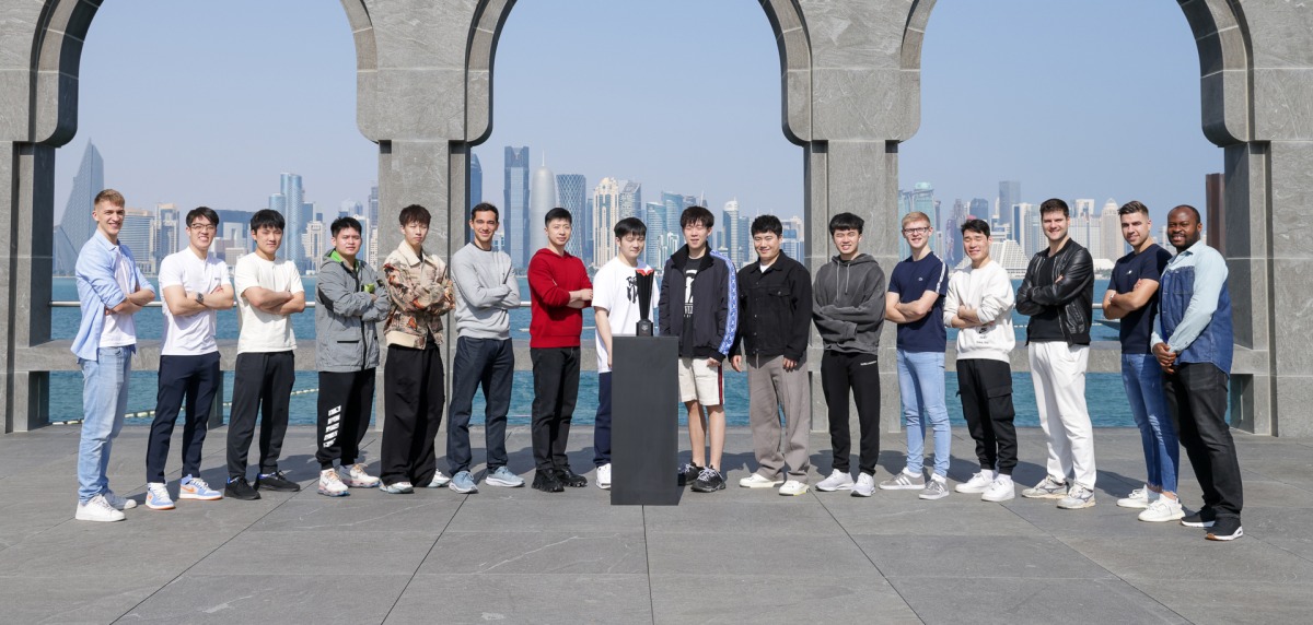 Players pose for a photograph with the WTT Finals Men trophy at Museum of Islamic Art, yesterday. 
