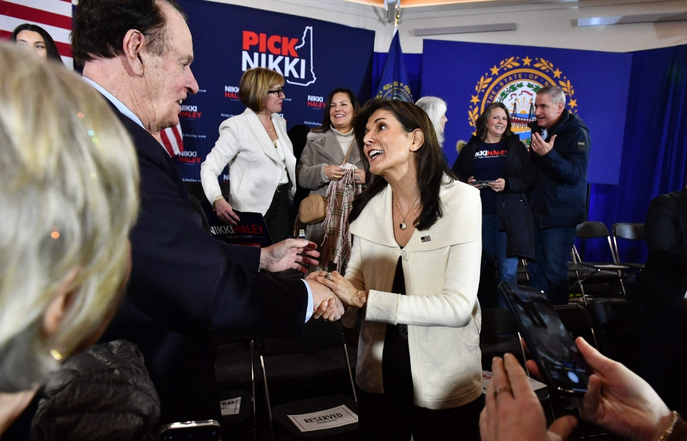 Former UN ambassador and 2024 Republican presidential hopeful Nikki Haley greets supporters during a campaign town hall event at Wentworth by the Sea Country Club in Rye, New Hampshire on January 2, 2024. (Photo by Joseph Prezioso / AFP)
