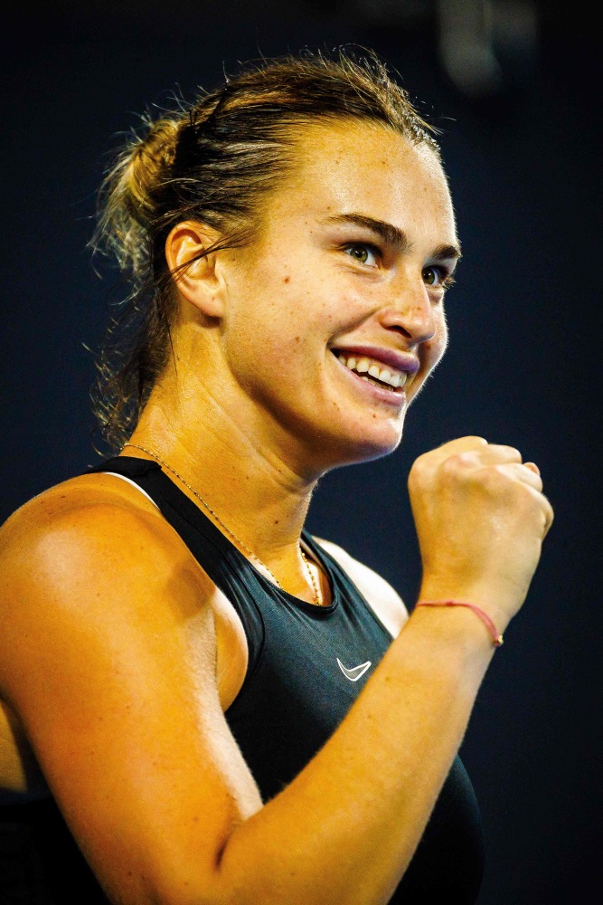 Aryna Sabalenka of Belarus reacts during her women's singles match against compatriot Victoria Azarenka at the Brisbane International tennis tournament in Brisbane on January 6, 2024. (Photo by Patrick HAMILTON / AFP)