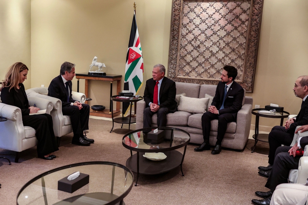 A handout picture released by the Jordanian Royal Palace shows Jordan's King Abdullah II receiving US Secretary of State Antony Blinken in Amman on January 7, 2024. (Photo by Jordanian Royal Palace / AFP)