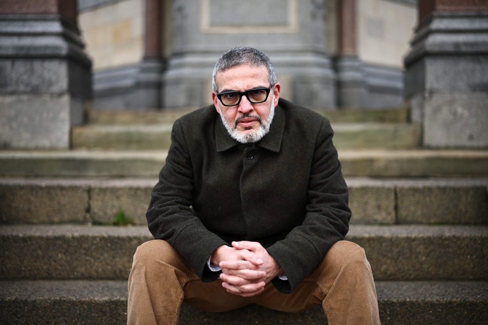 British-Palestinian plastic surgeon specialising in conflict injuries Ghassan Abu Sitta, poses for pictures in Victoria Park, east London, on January 7, 2024. (Photo by Henry Nicholls / AFP)