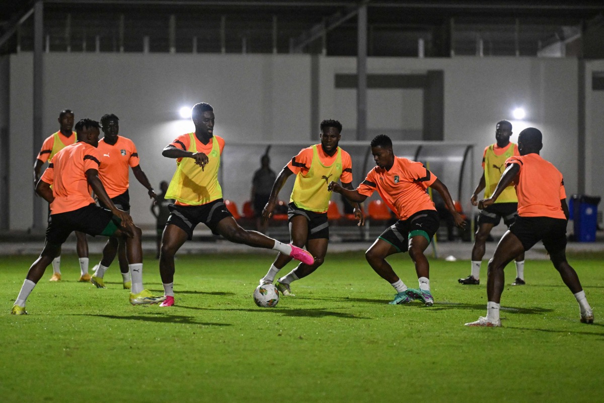 Ivory Coast's National Football team players take part during a training session at the technical's highschool stadium of Abidjan, on January 12, 2024, on the eve of the 2024 Africa Cup of Nations (CAN) football match between Ivory Coast and Guinea Bissau. (Photo by Issouf SANOGO / AFP)