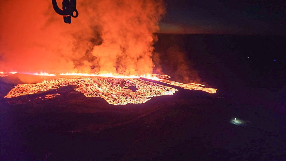 Billowing smoke and flowing lava are seen in this Icelandic Department of Civil Protection and Emergency Management , January 14, 2024, handout image during an volcanic eruption on the outskirts of the evacuated town of Grindavik, western Iceland. Photo by Icelandic Department of Civil Protection and Emergency Management / AFP