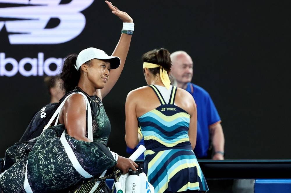 Japan's Naomi Osaka walks off the court after losing against France's Caroline Garcia on January 15, 2024. (Photo by David Gray / AFP)