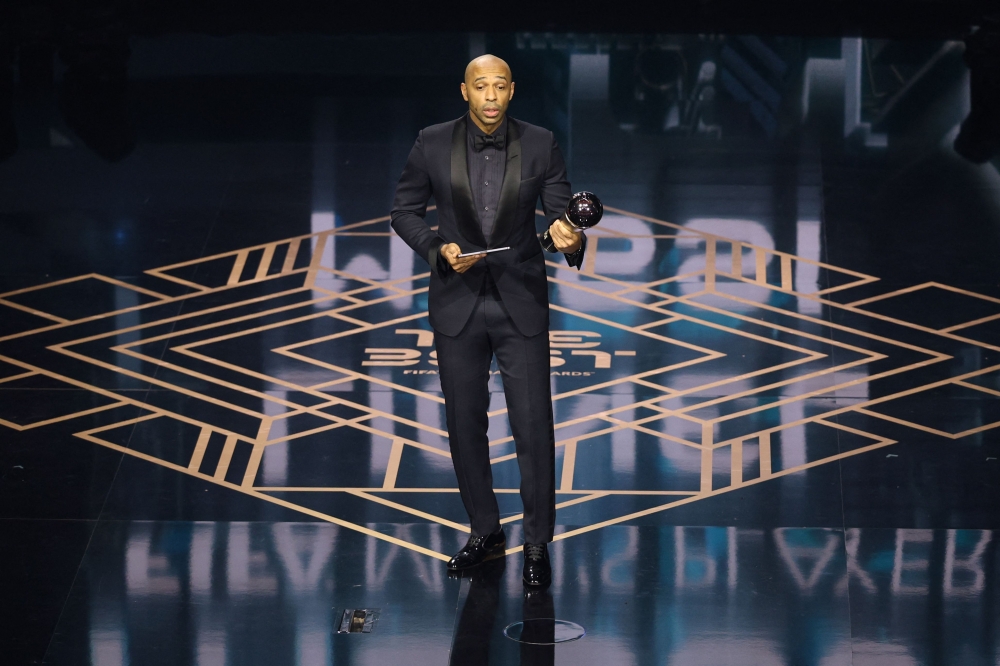 Thierry Henry on stage after collecting The Best FIFA Men's Player award on behalf of Lionel Messi during the Best FIFA Football Awards 2023. (Photo by Adrian Dennis / AFP)