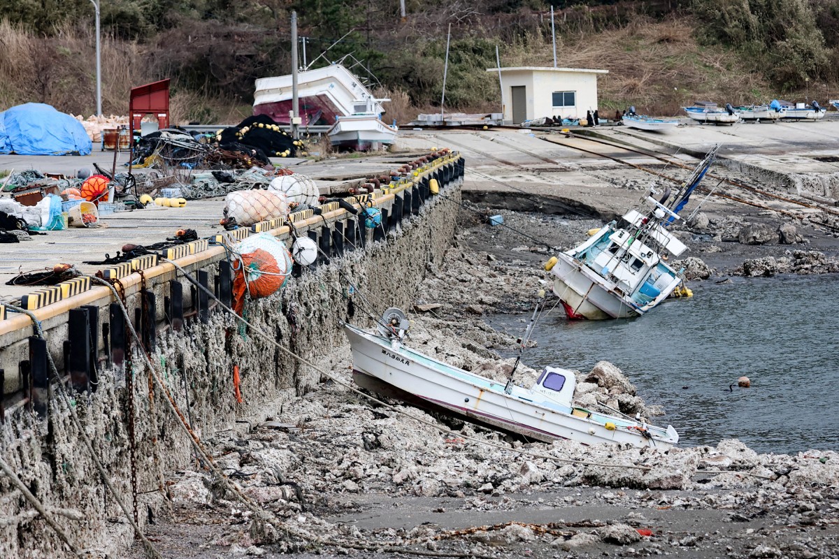 This photograph provided by Jiji Press and taken on January 12, 2024 shows the exposed ocean floor at Kaiso Port in Wajima city, Ishikawa prefecture in the after a 7.5 magnitude earthquake struck the Noto region in Ishikawa prefecture on New Year's Day. Photo by JIJI PRESS / AFP