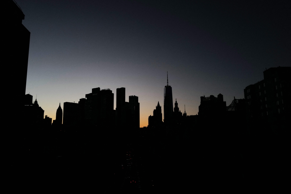 High-rise buildings are pictured at dusk in the Manhattan borough of New York city on January 14, 2024. (Photo by Charly TRIBALLEAU / AFP)
