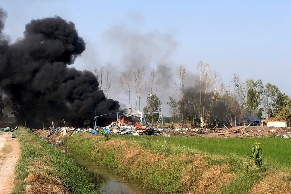 Handout released on January 17, 2024, shows smoke rising after an explosion at a fireworks factory near Sala Khao township in Thailand's Suphan Buri province. (Photo by Handout / Thailand's Novice Kaew Suphanburi Highway Rescue Association / AFP) 