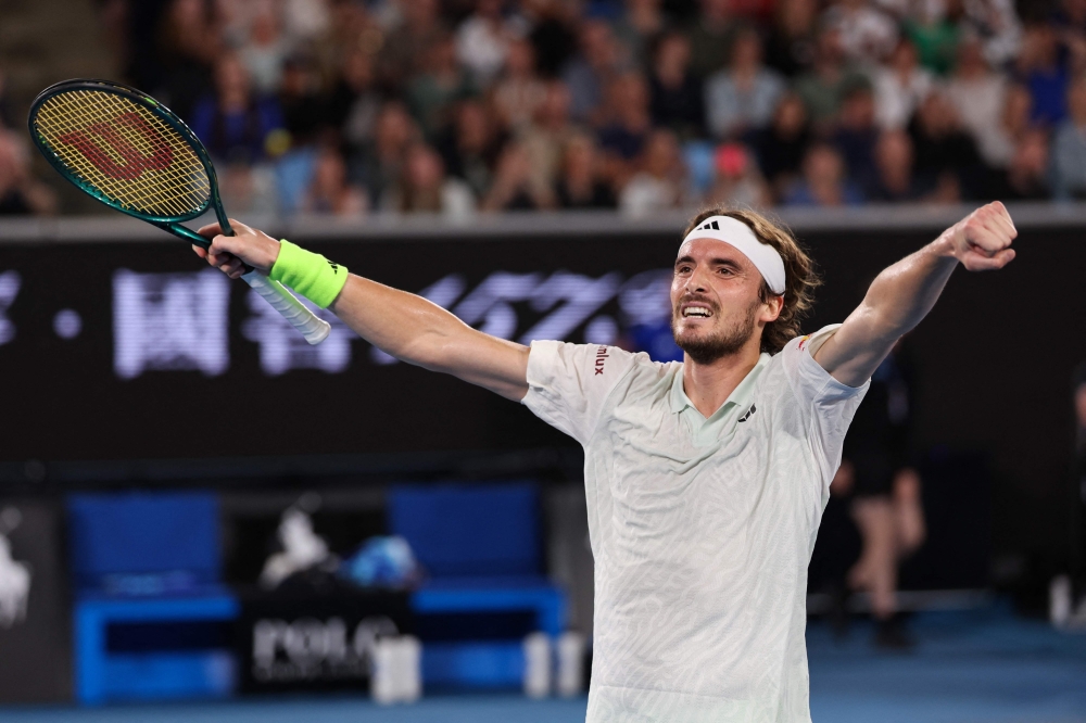 Greece's Stefanos Tsitsipas celebrates after victory against Australia's Jordan Thompson in Melbourne on January 17, 2024. (Photo by Martin Keep / AFP) / 