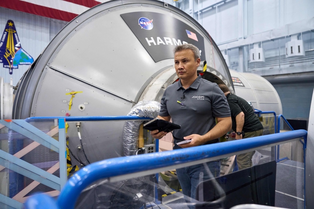 An unlocated handout picture taken on July 7, 2023 shows Turkish Astronaut Alper Gezeravci at work at the Kennedy Space Center. (Photo by Hatim Kaghat / AXIOM SPACE / AFP) 